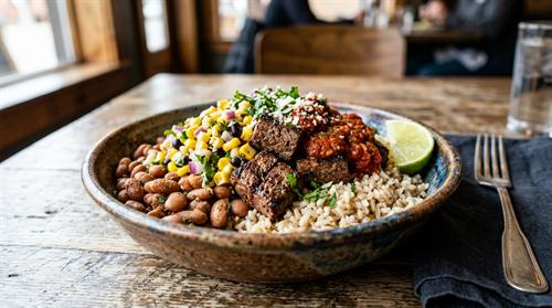 Pancheros flame grilled steak bowl loaded with rice, beans and corn salsa